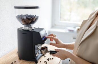 woman using coffee grinder