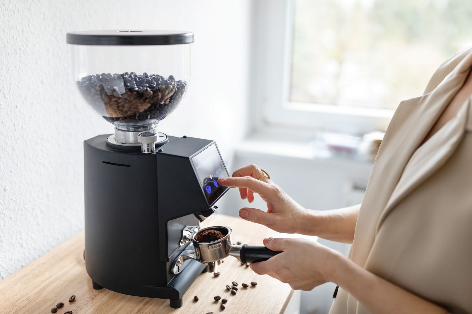 woman using coffee grinder